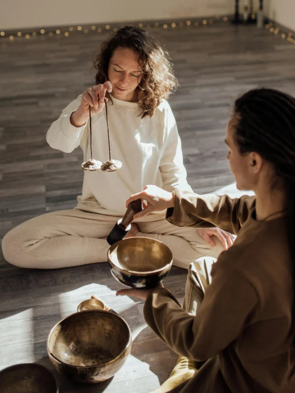 retreat dates two women doing sound healing