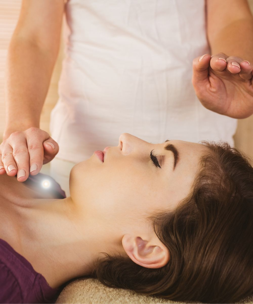 wellness therapies woman doing reiki
